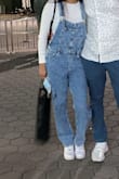 I got a small because I read other comments that the small fit better on taller people. 
The length was a little short but I was able to expand it with the belt on top of the shoulders to make it longer. 
Everything else fit great. - Mayra G.