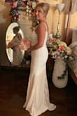 I read the reviews and pictures don't do it justice! This is a beautiful dress and I received a lot of compliments on it. The material is stretchy but it is clingy so keep that in mind. I wasn't disappointed at all!! I felt beautiful on my big day!! - Heather L.