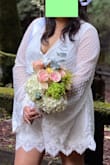 Really loved the sleeves on this and wanted my arms covered for my civil ceremony photos. Unfortunately the rest of the fit was very awkward. The waist was large and the bust was so tiny. I sized up so I could fit my chest into the romper. It still gapped quite a bit from lack of fabric. In the photo you can see that there was not enough to cover up bust, luckily I had double sided tape to tape everything down. Most of my photos turned out just fine ;) - Amber R.