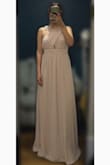I didn't like the dress at first sight but after I ironed it, it looked really cute. It's a bit long but if you have time you can send it to a seamstress otherwise you would have to be careful when walking or dancing. I received so many compliments. Overall really nice dress. Good material. Well made not cheap at all. - Maria F.