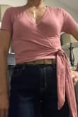I ordered this top in size XS at first, but decided to exchange it for a S because I wanted the top to sit lower on my midsection, and I'm glad I did. This top is very flattering. It accentuates and hugs the right curves. The color is lovely and the material is so soft. I am very pleased with this purchase. - Wendy D.