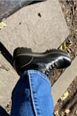 Have worn these every day since I got them! They feel larger when you first put them on but that is also coming from the bulk of the heel. I wear these with thick-ish socks and they feel great! Would order regular boot size but expect a little room. Wouldn't change a thing. - Julia B.