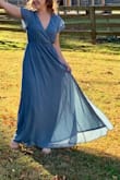 This dress fit me well, but definitely had some stretch to it so I could've gotten by with a size smaller. Great for engagement photos! - Natalie K.