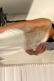 This dress fits me perfectly and feels so comfortable. The top is really stunning and even came with a few extra beads. I can't wait to wear it on my wedding day. - Lissette L.