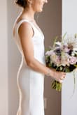 I could not have asked for a more perfect dress for my micro wedding. It was so reasonably priced and so simply understated. The fabric was thick (not see through at all, but I wore sticky petals and nude panties just in case) and stretchy (no issues walking/squatting/dancing). I loved the double V (not too low on the front or the back) and the back buttons (hid the back zipper fairly well!). It was so comfortable and it photographed so beautifully. True to size, I just needed it hemmed a few inches which was easily done by a local tailor. I will forever cherish this Lulu's dress. - Jamie P.