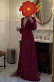 Wore this to a fall wedding and got so many compliments! The dress is very long, I wore with heels and it was still on the floor, but I didn't have time to get it hemmed. The color is a rich burgundy. The material feels light and swishy, obviously polyester, but not cheap feeling. It gives me fancy 70s nightgown vibes, and I mean that in the BEST WAY. - Whitney S.