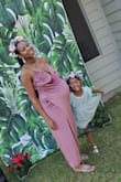 Love the stretch material. It was soft to the skin, it really just wrapped around me very nicely. Oh, and I loved the length. There really isn't much I can say because I got this dress for my baby shower. But I feel like I will purchase this dress again but in my normal size. - Marquetta H.