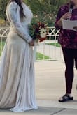 I love this dress! I knew as soon as I saw it listed, it was the one! I ordered a L and XL and the L fit perfectly! It hugged every curve just right and I felt really beautiful on my wedding day! It is a tad too long. I didn't make alterations and I kept stepping on it while walking, but I made it work. What I love most about this dress is how modest it is in the front bust area, but open back to show off my tattoo! - Briana W.