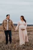 Beautiful dress and stunning quality of material. The blush color isn't too pink, it's a great neutral tone. The slit in the leg and the neck line make a flattering shape. I am 7 months pregnant, 215lbs 40DD and the large fit perfectly. Prepregnancy, I'm 185 lbs, this dress fit before too. Wasn't too snug or too big. I would say runs larger just because I'm usually an XL. If you're questioning it, BUY IT! - Carli C.