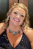 I wore a sticky bra to enhance my cleavage and I was asked twice if I had the dress custom-made & I'm very curvy aka voluptuous in butt & boobs and this dress hugged and accentuated all the curves. I'm a size 12 and wear XL. I wish I had more pictures! - Kristy J.