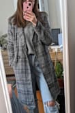 This coat is super cute! Not that warm, but as others have noted it's roomy enough that you can layer sweaters underneath. Love it for fall. - Gena D.