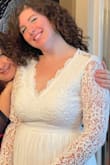 This dress is beautiful!!! It's elegant with lovely details, but the chiffon and crochet looking lace on the top keep it from looking too formal. It was just right for my husband and I's November Wedding :) The dress feels really well made, and I got a size medium based on reviews I read. From what I've gathered, the dress can run a bit larger on the top, but I found that it fits really well from the bust and sleeves, but was a bit tight above the waist where I had to zip and clasp it. But, I felt so beautiful in it and it cost me less than $80! What a win <3 - Victoria T.