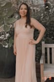 Very flattering it was a little to long I am 5'5 and even with heels it was dragging I had to get it altered to avoid stepping on it but other than that it fit perfect. - Genesis R.