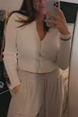 This cute little too really lives up to its title: ICONIC. Sometimes you never know what you're getting when you order a white top online, but the material was nice and thick, soft, and not see through! Very happy with my purchase! Sometimes there's a little gap between the buttons, but not that noticeable. Love, love, love! - Paige W.
