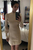 The material is surprisingly thick. I've tried on sweater dresses in the past that feel like tissue paper and this surprised me. The body hung in all the right places and the mock neck was super cute. My arms are a little bigger since I work out so the balloon sleeves could've been a little puffier but that is my only complaint. I ordered a size smaller as well since I wanted a more fitted look and I couldn't be happier! - Grace B.
