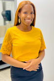 I wore this top to work. Everyone complimented me. It fits great! I bought a size small. My breast size is 32H (US) & 32FF (UK). I was able to wear an undershirt too. No problems. - Sophia R.