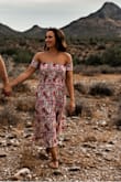 I wore this dress for my engagement photos and it's beautiful! It's very comfortable and you can dress it up or wear it more casually. It fits me perfectly and doesn't hit the ground despite my short height. Got lots of compliments each time I've worn it! - Patricia R.