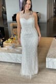 Very pretty! Really good quality in person and very sparkly! Not for me because I don't love the halter cut on myself, but worth a try on! - Marissa C.