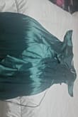 I love this dress so much! I got it for my bridesmaid but now I want it for myself. It fits so nicely and because it is a wrap dress well look good on lots of body types. It's a little long in the back and drags on the ground a bit but would be fine with high heels. It's a true emerald green and nice lightweight which is nice for my spring wedding. - Mikayla S.