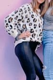 The quality is great. It's warm but not too heavy. I've gotten so many compliments when I wear this. - Kelsey S.