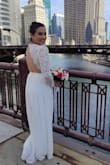 In the beginning, I ordered a medium size but it was a little loose for me, I could change it just on time to a small size for my wedding. The fabric is so soft and it has two layers on the skirt so there's nothing you can see under. And the details in the back, what a dream. I would recommend it to all my friends, also the customer service is really kind!! - Pilar R.