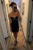 I could have sized up for a little more room but this dress fit like a glove! Very fun and flirty, the perfect Vegas or NYE dress. I was surprised by the stretch to the black material. Comfortable! - Karissa U.