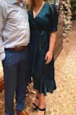 I wore this dress to a family function and I received so many compliments. The dress was comfortable and flattering. It has a lining layer underneath which was amazing. The dress wasn't clingy to my stomach (as I thought the material would show my belly button) and I wasn't fearful of the dress slipping open. Due to the nature of the event, I pinned the dress at my cleavage as I wanted to be conservative but depending on the event I would and could easily wear it again, unpinned. I experienced minor static but it went away quickly. I will definitely be wearing this dress again. - Maddie B.