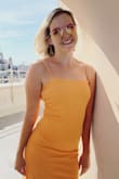 I adore this dress!!! Super comfy/stretchy and very flattering despite being form-fitting. True to size and gorgeous color just like the picture. - Rachel B.