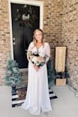 Loved this dress! I'm usually a medium in most things but with limited time prior to my wedding, I didn't want to have to do alterations on the bust area and ordered a small. It fit perfectly. However, if my waist or arms were any larger it would have been too snug as there is no stretch at the waist and not much at the arms. I've received so many compliments on this dress. - Melinda Z.