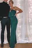 I ordered this jumpsuit in a M because I didn't want the stomach area to be too fitted. Because of that, I had to have the bust taken in and definitely had to have the legs shortened even with 3" heels! I got compliments all night and felt AMAZING! - Kate M.