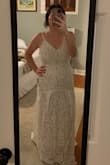 There is no "give" or stretch to this dress. I did love the lace and detail on the bottom of the dress. I could not get the zipper up past the seam and didn't want to damage the dress. - Stacey B.