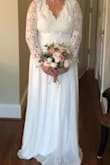Love this dress! I was worried about the back because of my broad shoulders but it actually somehow made them look more delicate. The macrame like material on top is very sturdy and pretty. This wasn't THE dress but I'm keeping it anyway for bridal shower - Stacey B.