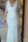 This dress felt well made and thick yet comfortable. The lace on the top around the neckline gave it a delicate and classy look. This wasn't the one for my adventure elopement but it's a beautiful dress. - Stacey B.