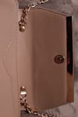 I was very disappointed with my purchase, I wish I listened to the review about the magnetic closure popping open too easily. It's a poor design because the strap sits underneath the opening, the strap should have instead been attached to the sides of the bag to prevent this from happening. - Emily B.