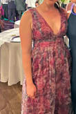 I wore this to a wedding and received so many compliments. The only issue was that the waistband was extremely tight. Everything else fit normally so I don't believe going a size up would have helped. I'm very small chested so the top fit just fine. I will say the deep V in the front is very deep! I ended up safety pinning it just a little. - Jordan B.
