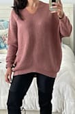 I like this sweater, I got a size S cuz its flowy (my size is usually between S and M) and it fit just nicely - Rania G.
