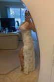 Gorgeous dress. Overall it fits true to size for M. For me at the chest area is small. The length is perfect, no need to adjust it. The straps are adjustable. I will wear it with no bra (it isn't see through). It is going to be for my small wedding reception. - Tanya S.