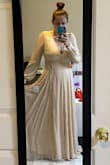 This dress is gorgeous! It's a much heavier weight than I expected for the price! The quality looks great, fit is awesome, length just grazes the floor on me, color is beautiful. I love the bishop sleeves and cute little buttons on the cuffs. I can't wait to wear this for my 10 year wedding anniversary photo shoot - Kaylee C.
