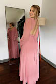 It's a beautiful dress but it's very very long. I took it to tailor to shorten and it was still too long. But love how it looks on the body. 
You just need to find something to support your breast with that amazing naked back. - Marta P.