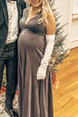 This dress is WOW. The color is a shimmery mauve with silver undertones that is so beautiful on any skin-tone. Pre-pregnancy, I'm 130 pounds and would have ordered an XS. I'm now 8 months pregnant, 150 pounds, and went with a Small. Also could've gone with a Medium for a looser fit. Velvet fabric is very comfortable, heavy, and ideal for cold months. It needed to be hemmed to accommodate my height (5'5 while wearing heels), and the top needed to be tailored, as it's cut low and suitable for slightly bigger busts. Definitely recommend trying this dress, as Lulu's makes returns easy if it's not what you're looking for (but it probably is!). - Brayden R.