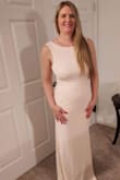 As soon as I saw this dress I knew it was the right one to wear as the mother of the bride. My daughter is getting married in the Smokey Mountains of Tennessee and I wanted an elegant dress because I am still too young to wear the dowdy dresses the bridal salons sell for hundreds of dollars. I feel super in this dress and the color is so pretty. I love the drape back and fit on my hourglass shape. I need some alterations to be what I want it to be. The zipper puckers on the hip area and it needs to be hemmed as all Lulu dresses. I got a stunning pearl necklace with a backdrop to wear with it. This dress will turn heads but won't take the attention off the bride. I always love the quality of Lulu clothes. I am 5'5", weigh 135 with a curvy hourglass figure. The large fits perfectly. It's heavy enough to not require any support unless you have any belly because it will show. - Judith D.