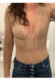 I loved this top! But maybe it's my long torso and lack of super high-rise options. Nothing I had worked with covering the bodysuit, even my most high rise of jeans. I would've had to wear something that came up to my ribs to cover the material once the top ends and bodysuit starts. I was most excited about wearing this top but had to return. - Jessica C.