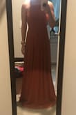 I love the material and the fit. It's lightweight and super flowy! Will have to get it tailored as it's still too long even with heels. However, the dress I received is much darker than what appears in the photos and reviews. Not sure if there are filters being used, maybe it's just the lighting, or maybe it's just how it looks next to my pale skin, but unfortunately the dress is too dark of a pink for the wedding I will be attending. I attached a photo of the dress next to another pink dress. I am keeping the dress though as I personally love it! - Nicole F.