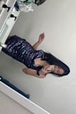 Got this on a whim because it was so sparkly. However, no regrets! It's super loose, and the adjustable straps work out perfectly for giving a more fitted look. It's definitely not black, more of a purple. - Taryn A.