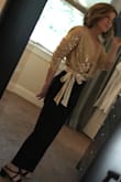 Pretty top for a dressy party or for New Year's Eve. I might need to Velcro the top a little bit to keep it from exposing too much if I bend down or popping open unexpectedly. The satin bow is pretty. There's a side zipper on the blouse so it is easy to put on and take off. - Denise M.