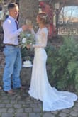 I wore this for my elopement and it was gorgeous! It ran a little big around my waist but it still worked without having it altered. It was perfect for my winter wedding. Only problem is it is see through. I wore white underwear and didn't realize it was see through until I saw my pictures and you could see straight through it. - Sydney F.