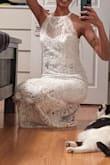 I saw some comments about how you can turn the dress into smaller one, it's true, there are 2 lengths to the dress but you would need a tailor to help. I was skeptical about the "curtain-ey" look of the bottom but it's AMAZING, looks so good with the laces etc! - Kirti J.