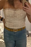 I wish it had a little better fit around the bust and was just a tad longer, but still cute! Unless you want it crop top, you'll need to wear it with fairly high-waisted jeans. - Kylee C.