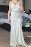 This dress is beautiful and fits really well. As with most maxi dresses, it is quite long, I'm only 5'2". The back of this dress is the show stopper! The front is plain yet very pretty and well made. I didn't choose this dress because it seemed more casual than the other lace dresses I ordered. - Jennifer R.