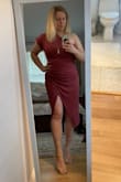I absolutely love this dress. The color is more of a dusty rose than the brighter red color on the model. - Kathleen O.